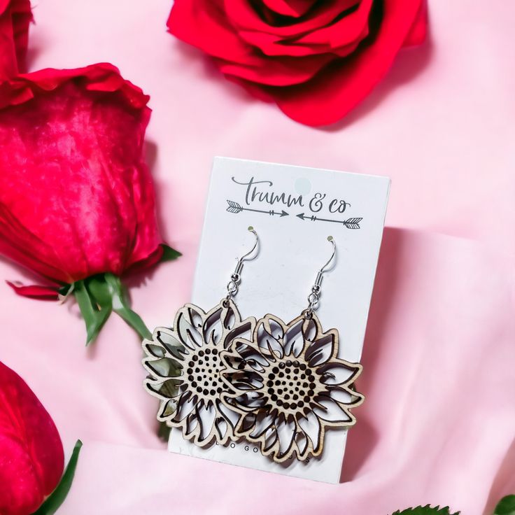 Sunflower-dangle earrings on trumm and co earring card  laying on pink fabric with red roses Sunflower Earrings, Sunflower Fields, Lightweight Earrings, Earring Crafts, Laser Cut Wood, Light Weight Earrings, Top Seller, Day And Night, Earrings Dangle