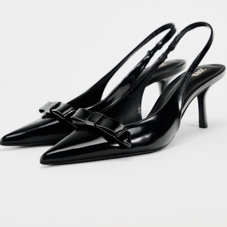 Slingback Heels With Faux Patent Leather Finish.Bow Detail At Front. Pointed Toe. Back Strap With Elastic Heel Height: 2.4inches (6cm) Black | 2265 /310 Upper 100% Polyurethane Lining 100% Polyurethane Sole 100% Polyurethane Thermoplastic Insole 100% Polyurethane Zara Slingback Sandals For Spring Formal, Zara Formal Slingback Pumps With Open Heel, Zara Evening Slingback Pumps For Spring, Zara Formal Slingback Pumps, Elegant Zara Leather Slingback Pumps, Formal Slingback Pumps By Zara, Elegant Zara Leather Slingback Sandals, Elegant Zara Slingback Sandals For Spring, Zara Chic Slingback Pumps For Work