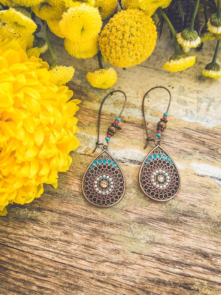 Add a touch of bohemian beauty to your style with our Copper Beaded Boho Drop Earrings. These elegant and versatile accessories capture the timeless and free-spirited essence of boho chic, for a look that's both captivating and unique. Bohemian Brown Earrings As Gift, Bohemian Brown Earrings For Gift, Brown Bohemian Dangle Earrings, Bohemian Teardrop Jewelry With Ear Wire, Bohemian Brown Beaded Nickel-free Earrings, Bohemian Dangle Earrings For Beach, Summer Bohemian Brown Earrings, Bohemian Turquoise Beaded Brass Earrings, Bohemian Turquoise Beaded Earrings With Brass