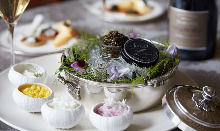 an assortment of desserts and wine on a table