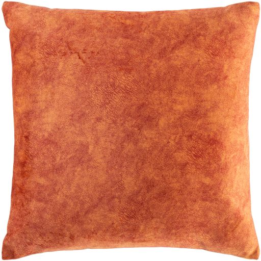 an orange pillow on a white background