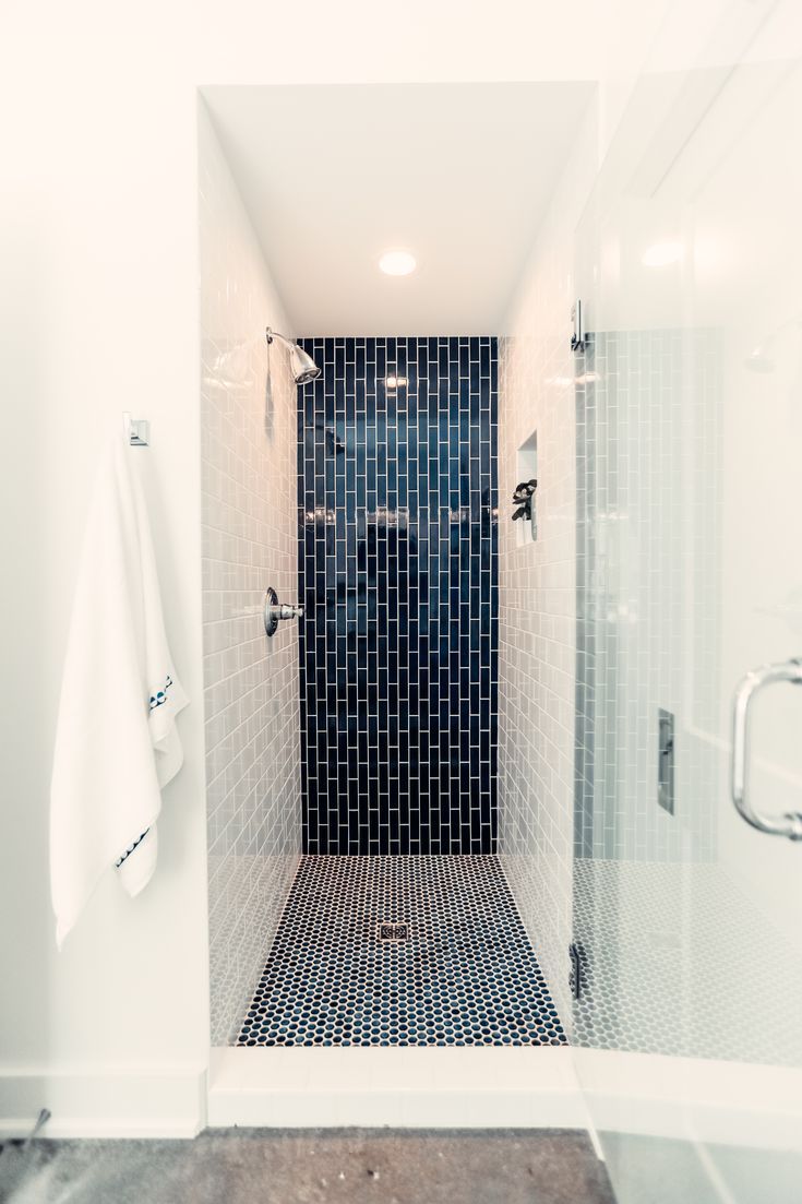 a walk in shower sitting inside of a bathroom