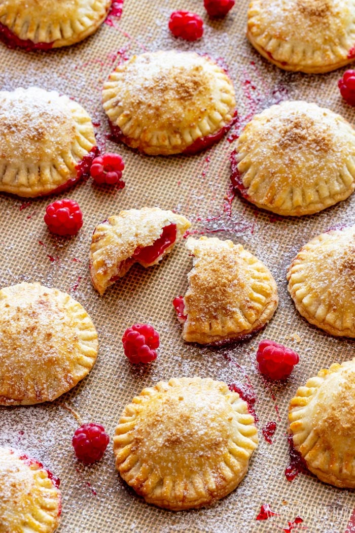 raspberry hand pies on a baking sheet