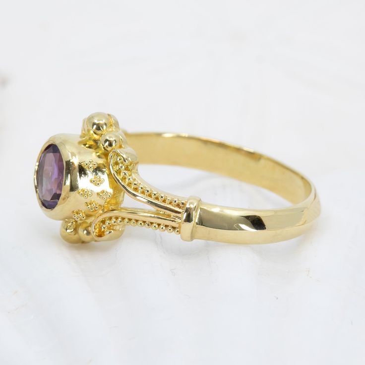 Unleash your inner classic beauty with this Amethyst Classical Ring, a luxurious 18K gold piece featuring intricate Etruscan granulation and a 6mm velvety purple amethyst. Enjoy wearing this gorgeous ring for any occasion. 18K gold ring features a row of granulation down each side as well as on the sides of the bezel. The elegant ring is set with a 6mm amethyst and a beveled lower band. Shown in a size 8, but each ring comes with free sizing and FREE SHIPPING! Unsure what ring size you are? It's Low Band, Special Ring, 18k Gold Ring, Gold Piece, Elegant Ring, Classic Beauty, Purple Amethyst, Gold Ring, Gold Rings