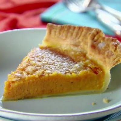 a piece of pie sitting on top of a white plate