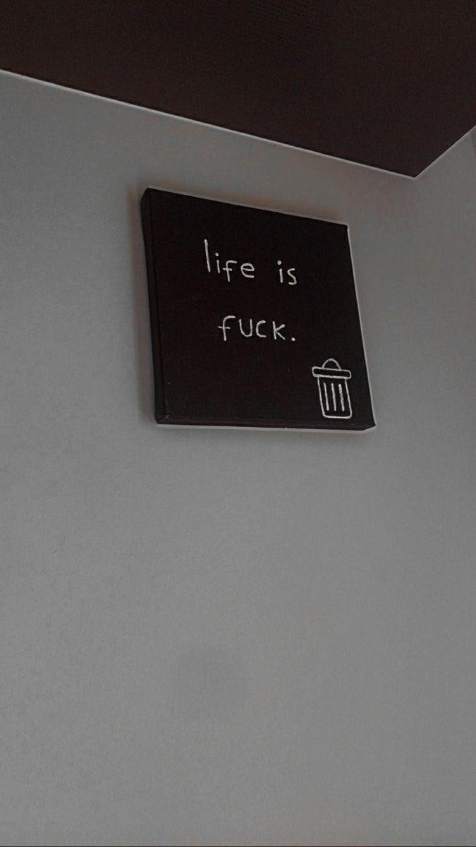 there is a sign on the wall that says, life is f kk '