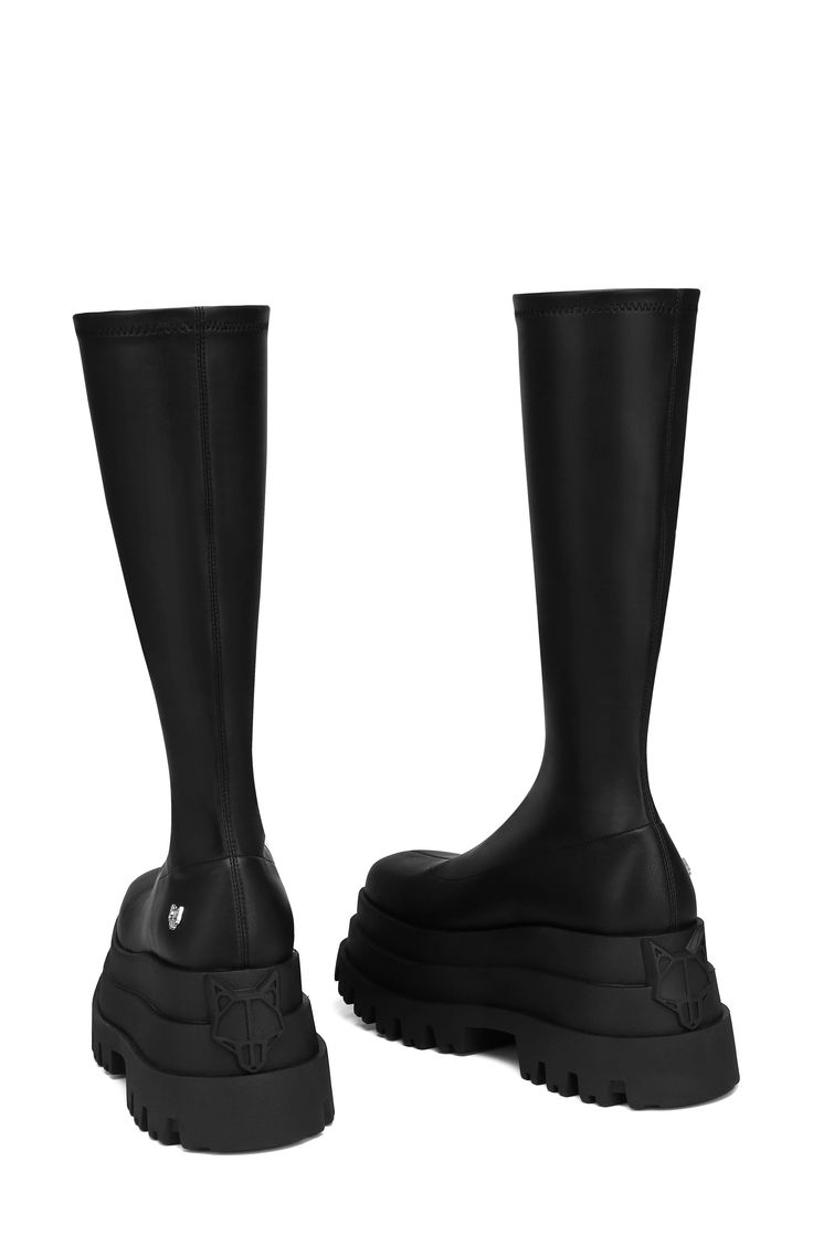 It's worth giving into your style temptation with this skin-hugging tall boot boasting a three-tiered platform sole for a look that's almost shameless. Exclusive retailer 3 1/2" platform Synthetic upper/textile lining/synthetic sole Imported Leather Knee-high Boots, Black High Shaft Platform Boots, Black High Cut Leather Knee-high Boots, Black Leather High Cut Knee-high Boots, Black Knee-high Boots With Chunky Platform, Knee-high Platform Boots With Lug Sole For Streetwear, Alternative Black Knee-high Platform Boots, Black Chunky Platform Knee-high Boots, Black Naked Wolfe Shoes