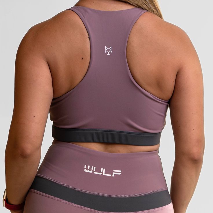 MATERIAL: 63% nylon/37%spandex FIT: ﻿True to size. DESIGN: Sports bra with scoop neckline. Medium support bra. Added zipper in the middle of the chest. Available in purple/black and gray/black. MODEL: Model is 5'5", 120 lbs, wearing a size Medium. WASHING: We recommend washing inside-out on a cold setting. Hang to dry. This sensational sports bra is designed to elevate your workout and give you confidence in the gym. Crafted with a chic scoop neckline, this medium support gym bra embraces your c Purple Nylon Activewear For Workout, Purple Nylon Activewear For Gym, Scoop Neck Sports Bra Fitted, Workout Scoop Neck Fitted Bra, Breathable Purple Athleisure Sports Bra, Purple Stretch Sports Bra For Workout, Functional Purple Sports Bra For Workout, Purple Compressive Sports Bra For Sports, Sporty Fitted Scoop Neck Bra