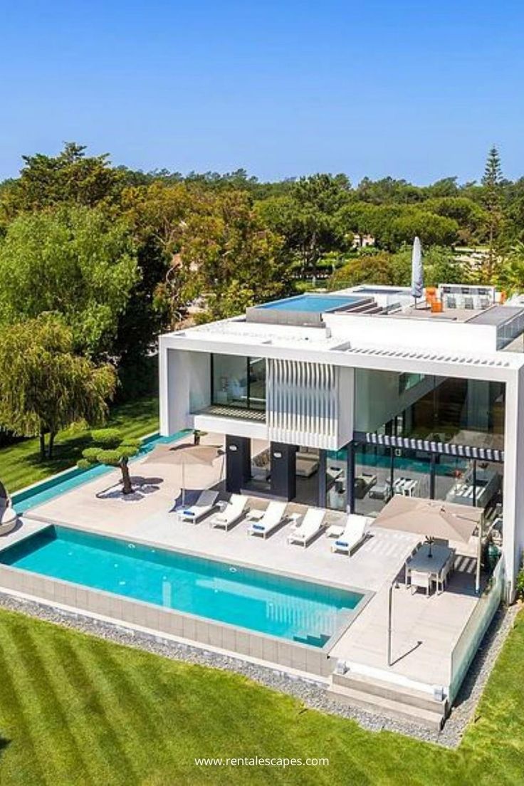 an aerial view of a house with a swimming pool