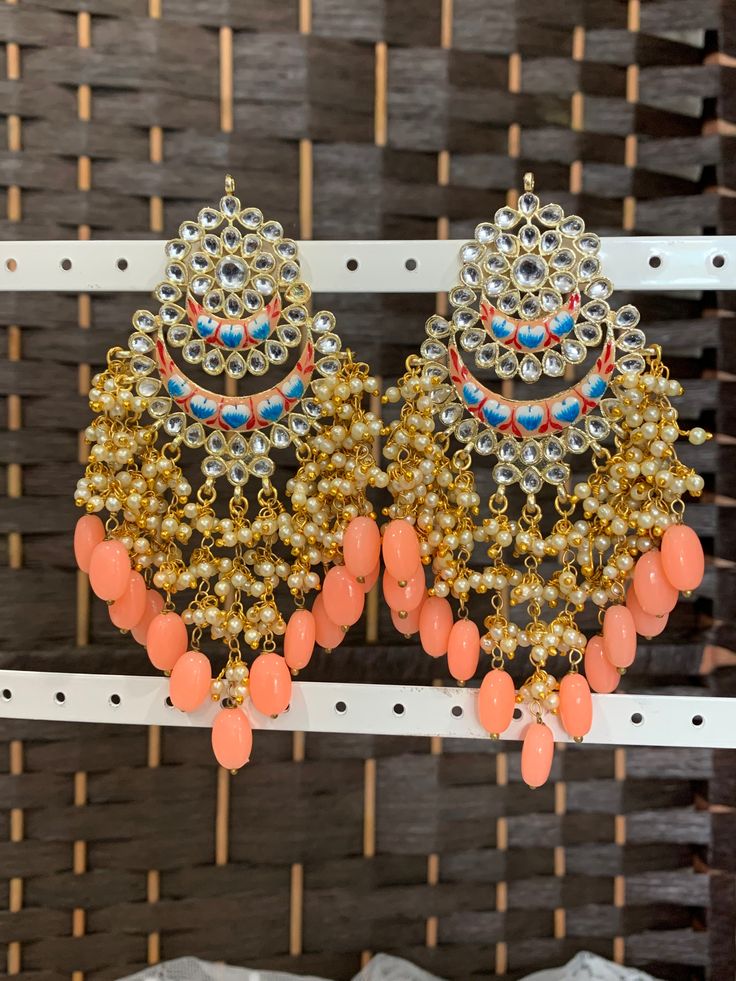 Hand painted meena earring . Push back. Approximately 5 inch long Handmade Enamel Earrings For Wedding, Handmade Enamel Earrings For Party, Metal Chandbali Danglers With Meenakari, Metal Meenakari Chandbali Danglers, Chandbali Meenakari Danglers In Metal, Kundan Beaded Earrings For Festivals, Bohemian Kundan Earrings With Stone Work, Mirror Work Earrings For Festivals, Handmade Kundan Dangle Earrings