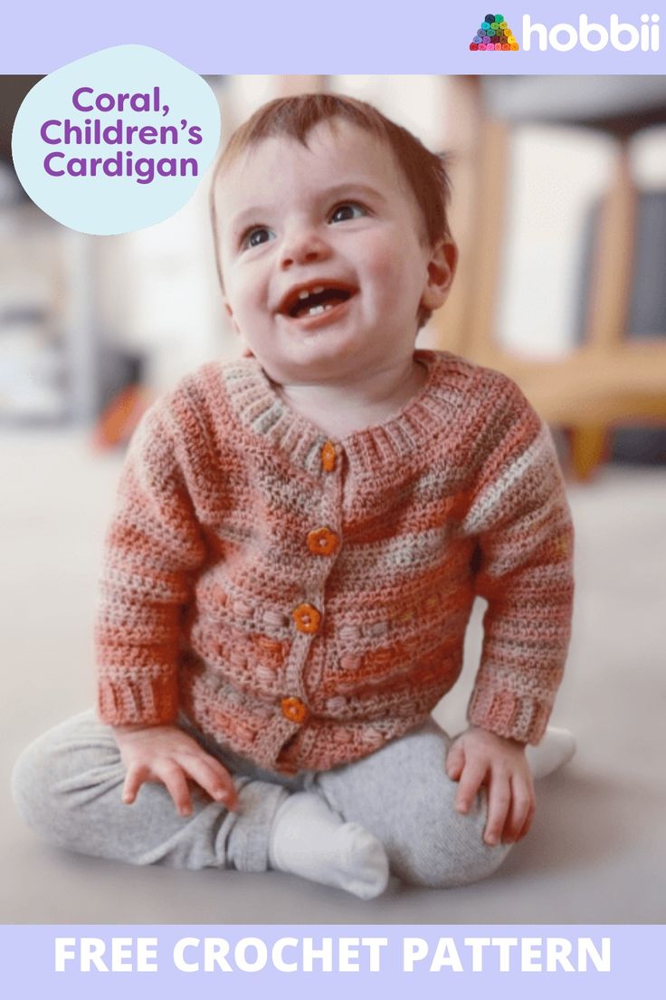 a baby sitting on the floor wearing a knitted sweater and smiling at the camera with text overlay that reads coral, children's cardigan free crochet pattern