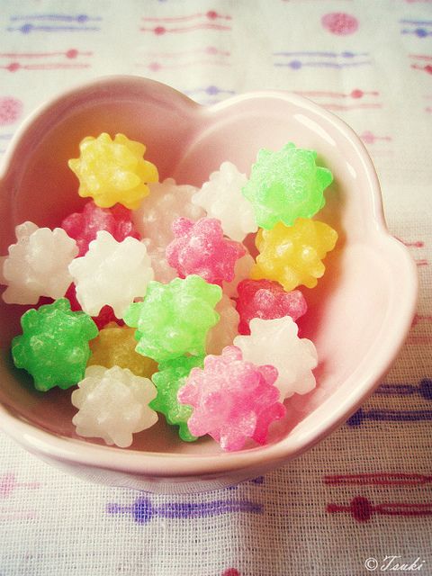 small gummy bears in a pink bowl on a table