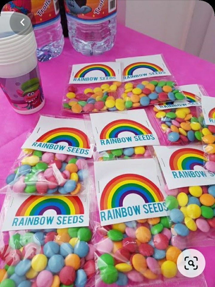 there are many rainbow seeds on the table