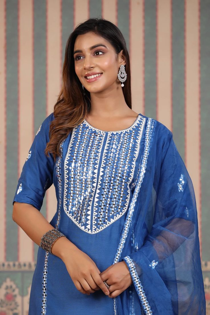 Be a vision in our Blue Tie And Dye Sharara Suit Set. Crafted in cooling blue hues of muslin featuring a unique tie and dye design, this lovely suit set is the perfect choice for summer weddings and festive occasions. The set is complete with an airy organza dupatta to add a touch of harmony to the ensemble. No. of pieces - 3 piece set. Color - Blue. Fabric - Muslin. Washing Instructions - Dry Clean.