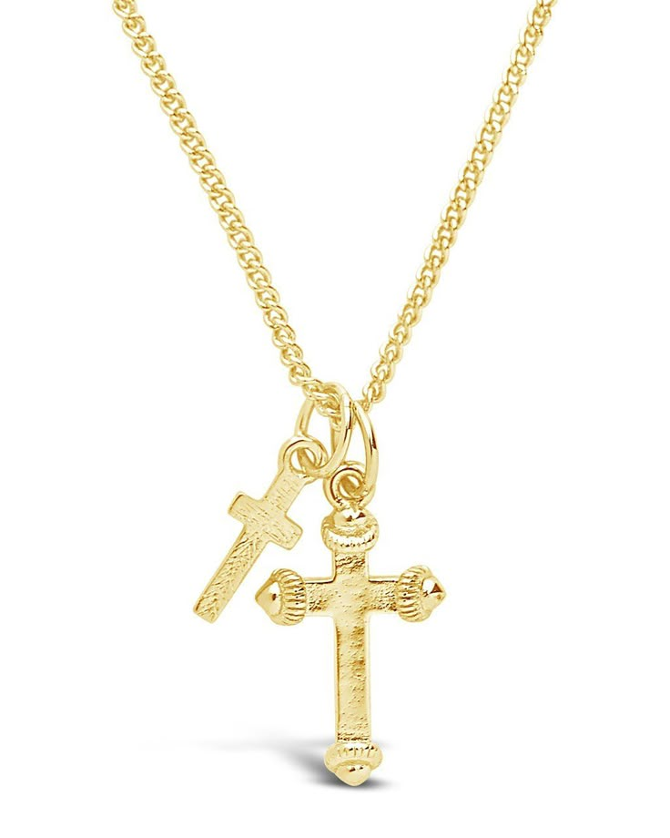 Two beautiful gold cross pendants hang from this delicate chain, giving it a little more flair than a traditional single cross necklace. It's an ideal gift for anyone who's about to celebrate a wedding, a confirmation or a First Communion. Made from high quality materials to last for years to come. Materials: 14K Gold plated Brass Features: Approx. 16" chain with 2" extender featuring sturdy lobster clasp, 14mm & 10mm cross charms Mens Gold Jewelry, Gold Cross Necklace, Gold Cross Pendant, Jewelry Accessories Ideas, Dope Jewelry, Statement Drop Earrings, Jewelry Lookbook, Delicate Chain, Cross Charms