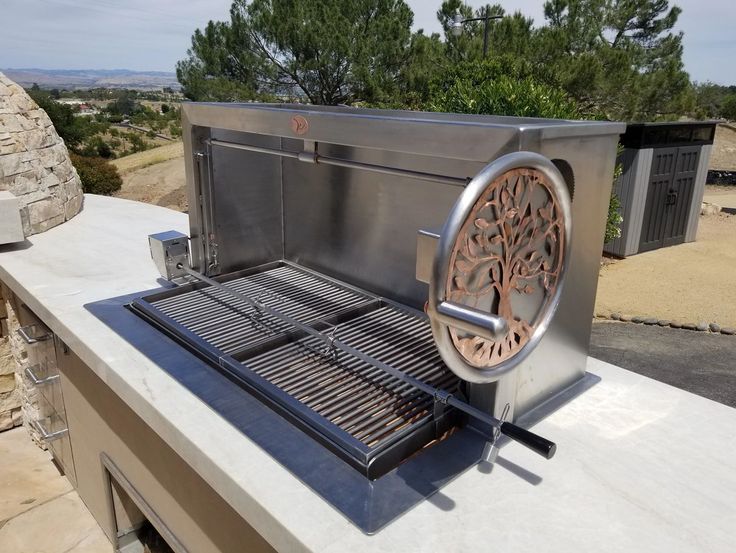 an outdoor grill on top of a building