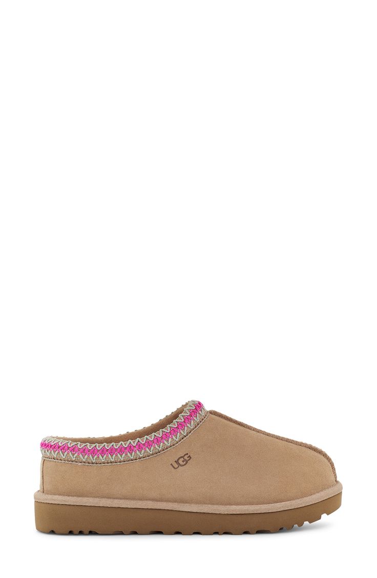 A warm, suede slipper with embroidered trim and a plush genuine-shearling lining can be worn in or out of the house thanks to the grippy sole. Slight dye transfer may occur with darker colors during first few wears Leather upper/genuine-shearling or genuine-shearling and UGGpure wool lining/rubber sole Shearling may be sourced from Australia, Ireland, Spain, the UK or the USA. See packaging for confirmed country of origin UGGpure, a moisture-wicking textile made entirely from wool but crafted to Pink Ugg Tasman, Ugg Slippers Tasman, Gift Wishlist Ideas, Christmas List Ideas For Women, Christmas Gift Wishlist, Cute Uggs, Pretty Sneakers, Ugg Tasman Slippers, Holiday Wishlist