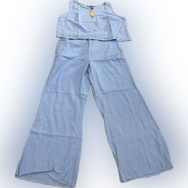 Women’s 2pc Pants Suite. Wide Legs. Sleeveless. Light Blue. Large. Spring Cotton Pant Set With Pockets, Casual Light Blue Sets With Pockets, Casual Blue Sets For Day Out, Casual Sleeveless Set For Day Out, Light Blue Casual Sets For Vacation, Casual Light Blue Sets For Vacation, Casual Blue Two-piece Bottoms Set, Blue Two-piece Pant Set For Spring, Casual Two-piece Set Bottoms For Vacation