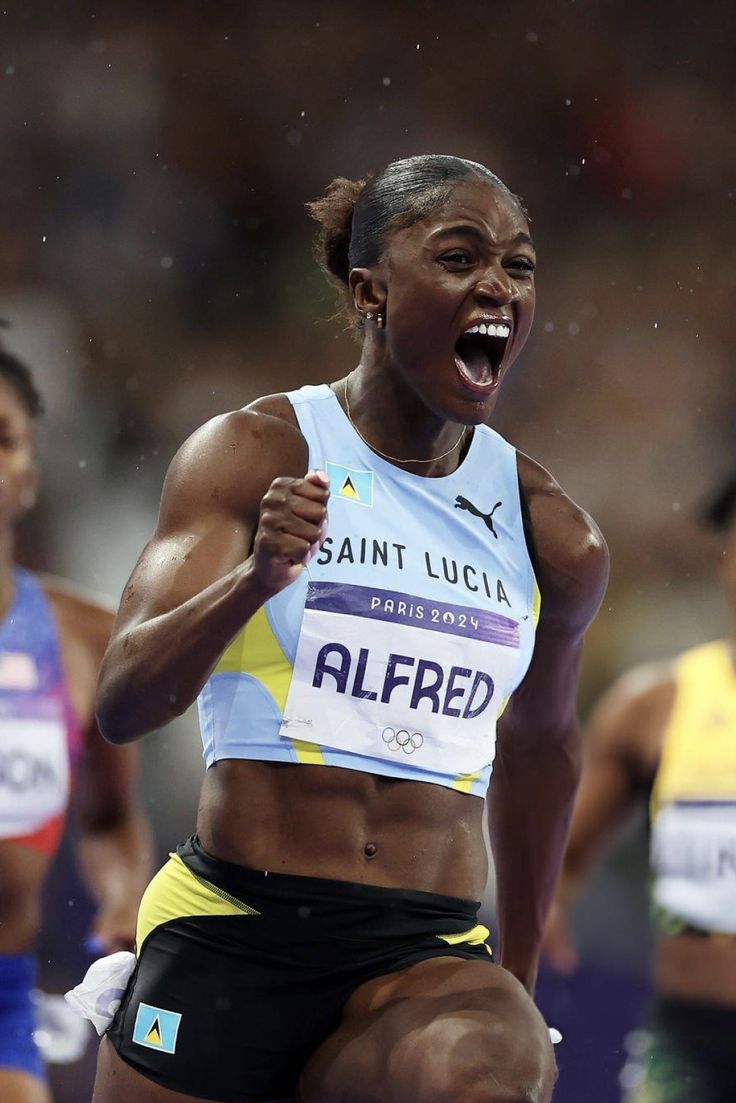 a woman running in a race with her mouth open