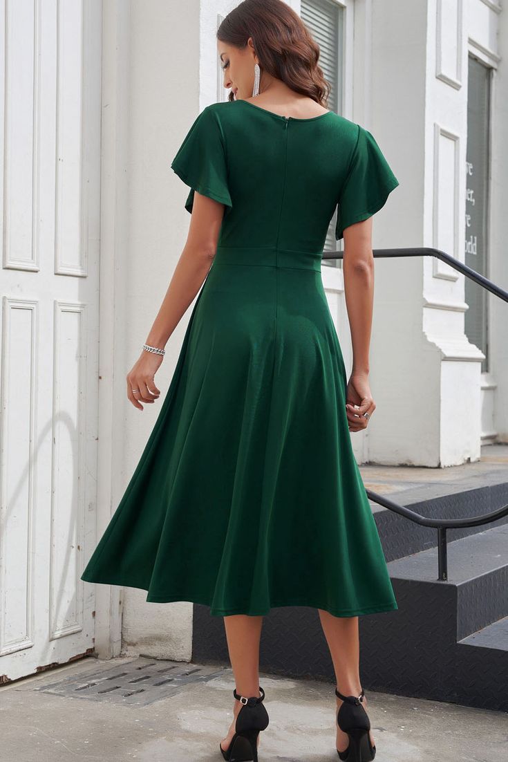 Green Ruffled Sleeve Wrap V Neck Midi Dress Green Ruffled Midi Dress For Work, Green Midi Dress With Ruffles For Work, Solid Color A-line Midi Dress With Ruffles, Green A-line Midi Dress With Ruffle Hem, Solid Midi Dress With Ruffles For Work, Casual Midi Dress With Ruffle Hem For Evening, Elegant Green Midi Dress With Flutter Sleeves, Fitted Knee Length Dress, Hollywood Glamor