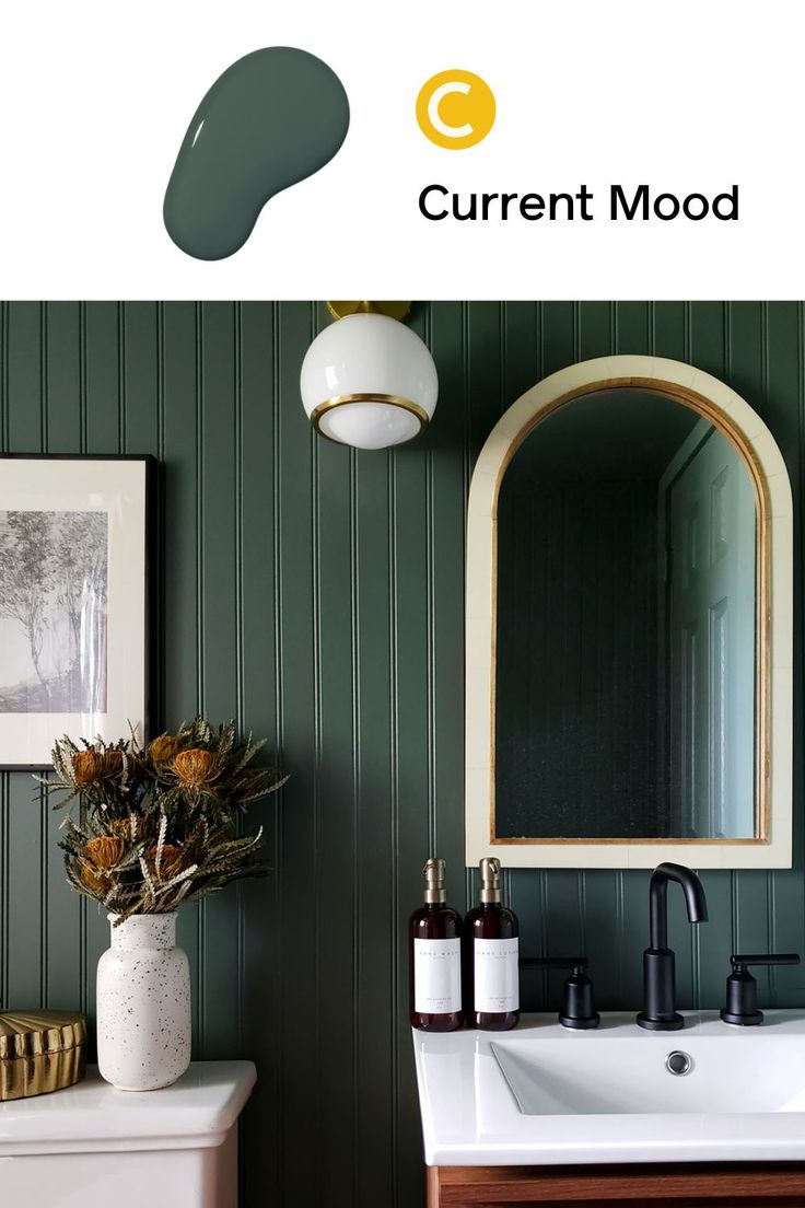 a bathroom with green striped walls and white sink in the corner, next to a mirror that reads current mood