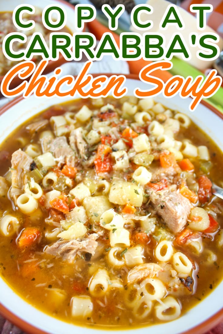 copycat carrabba's chicken soup with pasta and carrots in a white bowl