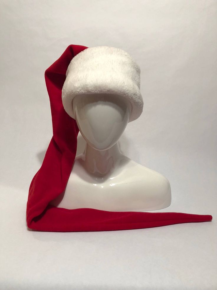 Santa Hat with extra long tail and super wide brim. Perfect for getting your ho ho ho on. Tail can be wrapped around neck to keep off the chill. Made of high quilt super soft fleece. Every hat is handmade. Sizes available are: Adult: 22-24 inches Head circumference Youth: 21-23 inches Child: 19-22 inches Toddler: 18-20 inches Other color combos are available . . . please message me. Thanks! Philly Eagles, Christmas Gift List, Womens March, Cat Hat, Ho Ho Ho, Long Tail, Hair Piece, Santa Hat, Wide Brimmed