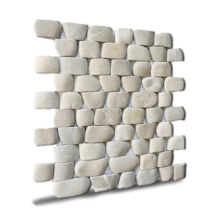 a white stone wall mounted on the side of a building