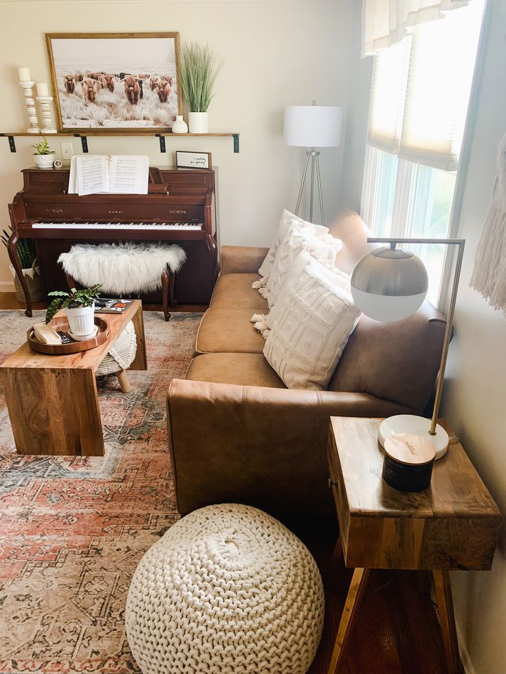 a living room filled with furniture and a piano