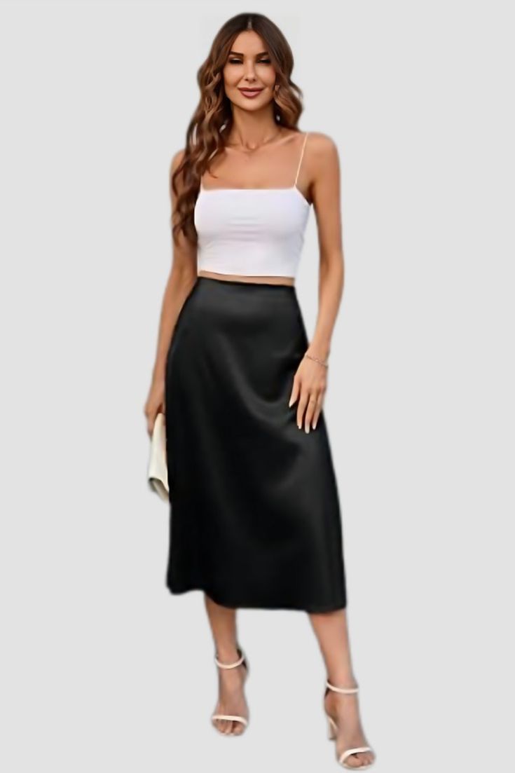 Looking for a stylish and versatile skirt that can be dressed up or down? Look no further than the Black Satin High Rise Midi Skirt! This skirt is perfect for any occasion, from a night out on the town to a casual day at the office. The high waist flatters your figure and the midi length is both stylish and practical. The soft satin fabric is comfortable to wear all day long and the black colour is perfect for any outfit. Pair this skirt with a blouse and heels for a dressy look, or with a t-shi Pleated Midi Skirt For Night Out, Casual Evening Maxi Skirt With Relaxed Fit, Casual Maxi Skirt For Evening, Casual Evening Maxi Skirt, Casual Relaxed Maxi Skirt For Evening, Elegant Spring Skirt For Going Out, Elegant Skirt For Going Out In Spring, Going Out Midi Skirt With Lining, Going Out Lined Midi Skirt