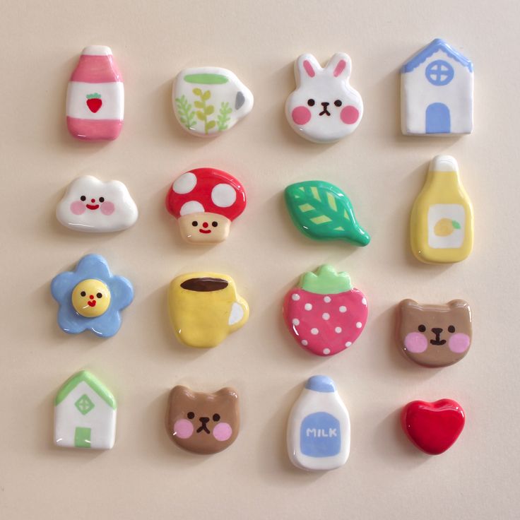 there are many small toy magnets on the wall in this photo, each with different designs