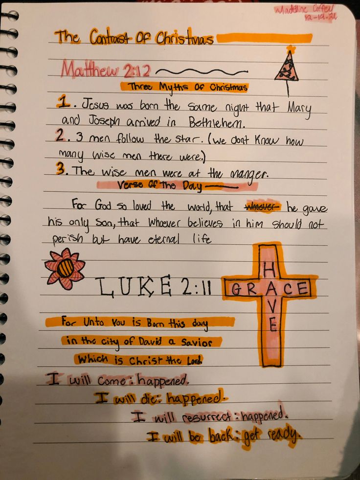 a notebook with some writing on it and an image of a cross in the middle