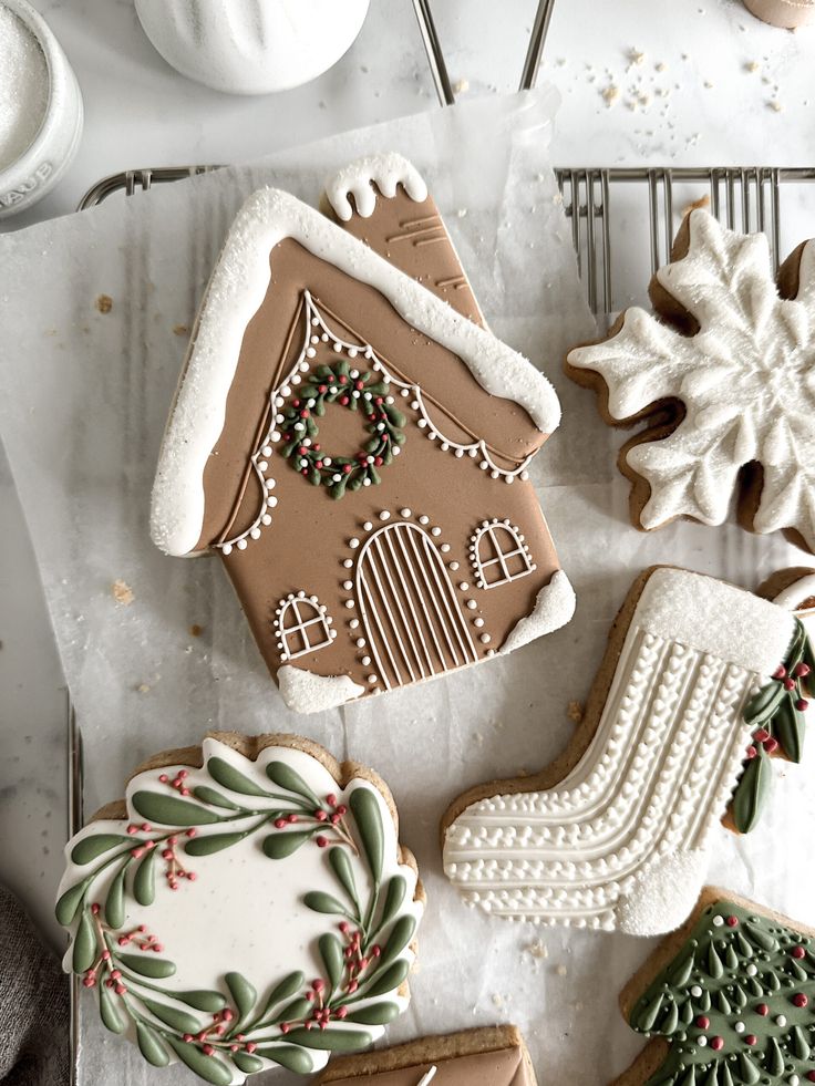 decorated cookies and other holiday treats on a table