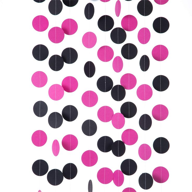 pink and black polka dots hanging from strings