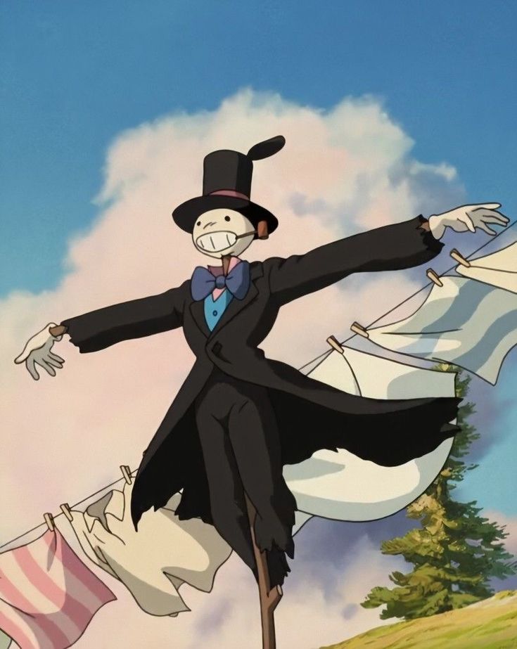 a man in a suit and top hat standing on clothes line with his arms outstretched