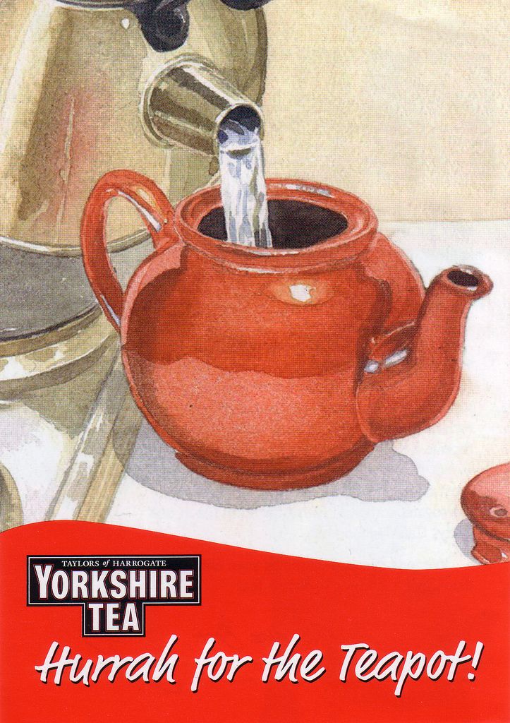 an advertisement for yorkshire tea, featuring a red kettle with water pouring out of it