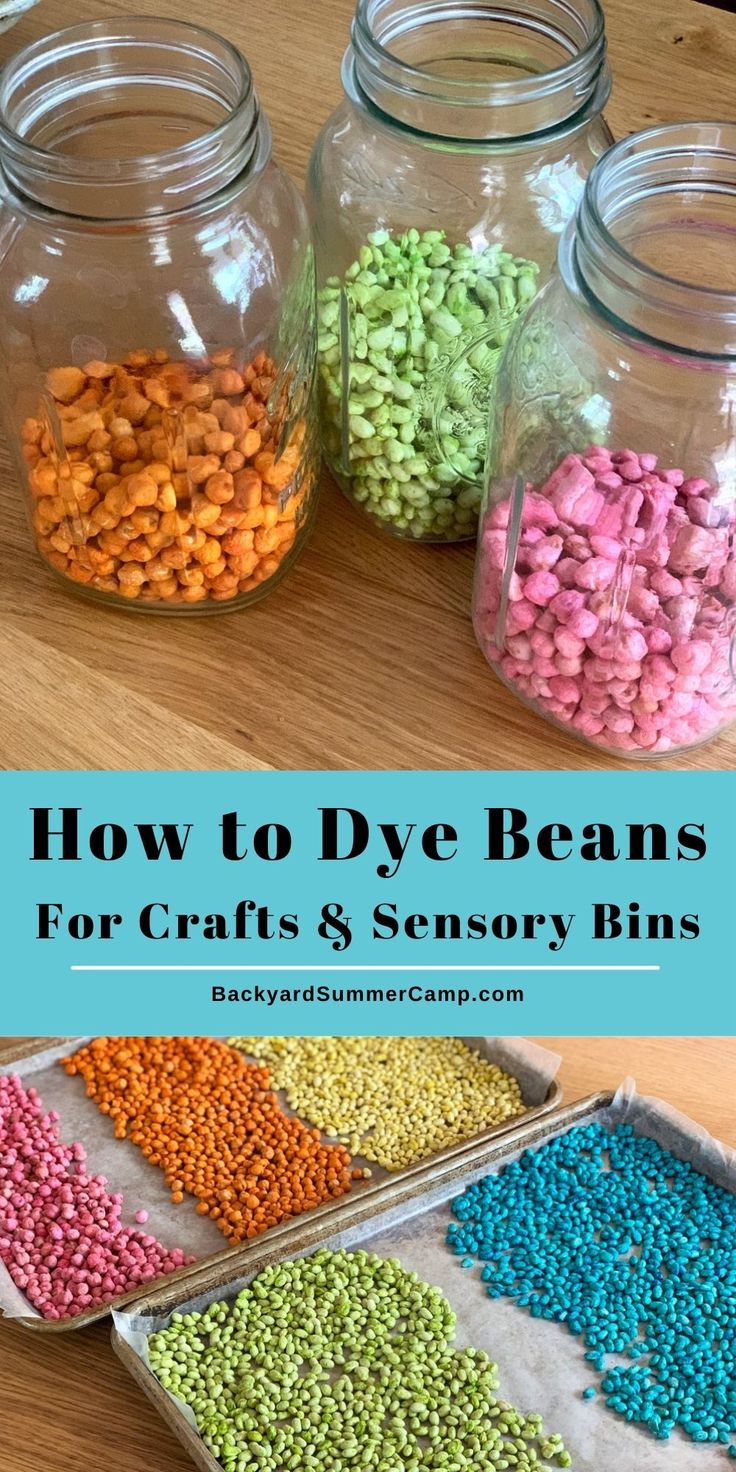 three jars filled with different colored beans on top of a wooden table