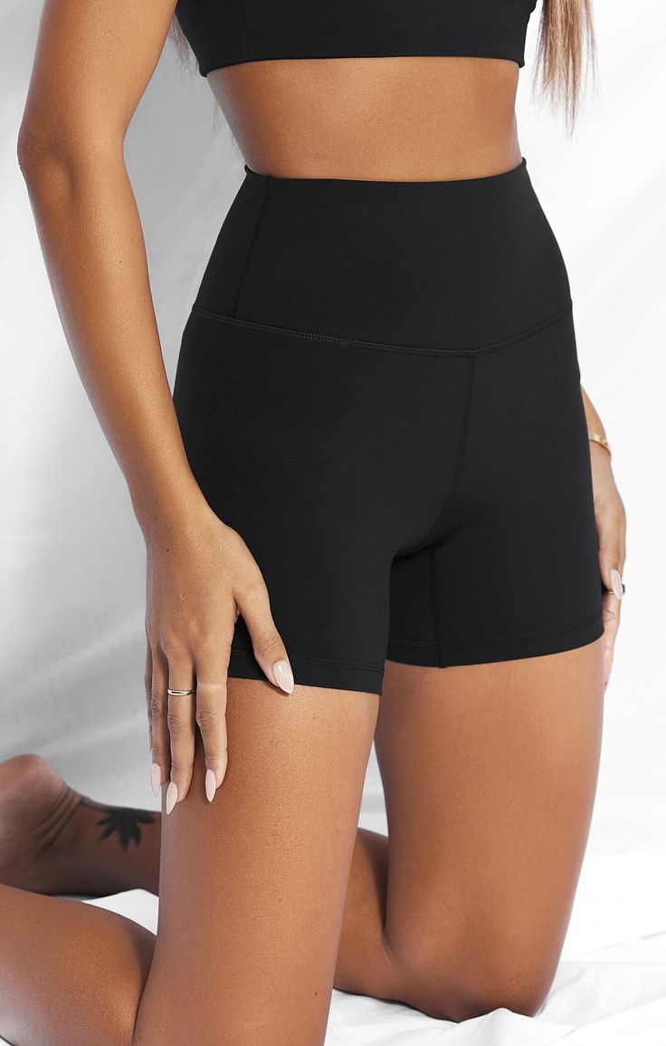 You won't want to take these off... Experience the Sculpt™ effect. Built from your favourite premium smoothing & lifting blend, these seamless 5" bike shorts are a staple in your active and leisure wardrobe. Pair with matching Sculpt™ and Sweat™ essentials for the ultimate effortless, everyday look. 75% polyester | 25% spandex Butter, second skin feeling Wide, doubled waist band with flattering 'V' shaping at back Black 3D rubberised logo printed on back Size S inseam length = 5 inch with 0.5cm Black Breathable Athletic Shorts With High Stretch, Compressive Sweat-resistant Athletic Shorts, Black Moisture-wicking Elastane Biker Shorts, Black Elastane Biker Shorts For Gym, Black Elastane Biker Shorts For Workout, Black Mid-thigh Length Elastane Activewear, Black Micro-elastic Athletic Shorts With Built-in Shorts, Breathable Solid Biker Shorts For Gym, High Stretch Black Activewear Mid-thigh Length