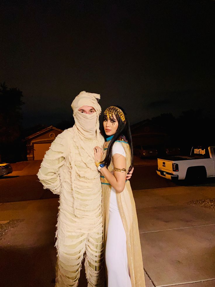 two people in costumes standing next to each other