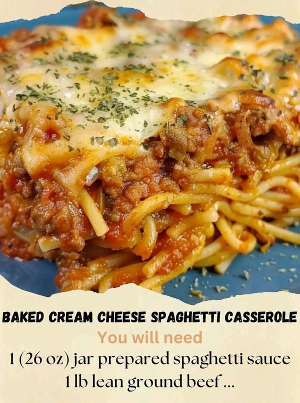 a blue plate topped with pasta covered in cheese and sauce next to a white background