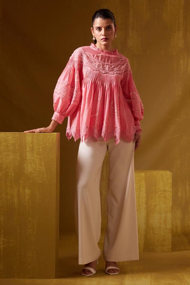 Pink cutwork hem top with floral print and lace work.
Components: 1
Pattern: Print
Type Of Work: Floral
Neckline: High neck
Sleeve Type: Balloon Sleeves
Fabric: Cotton Silk
Color: Pink
Other Details: 
Model height: 5ft 9inches, wearing size XS
Note: Pant worn by the model is not for sale
Occasion: Resort - Aza Fashions Flower Print Top, Garment Care Labels, Flower Top, Flower Tops, Hem Top, Top For Women, Pink Blouse, Cut Work, Balloon Sleeves