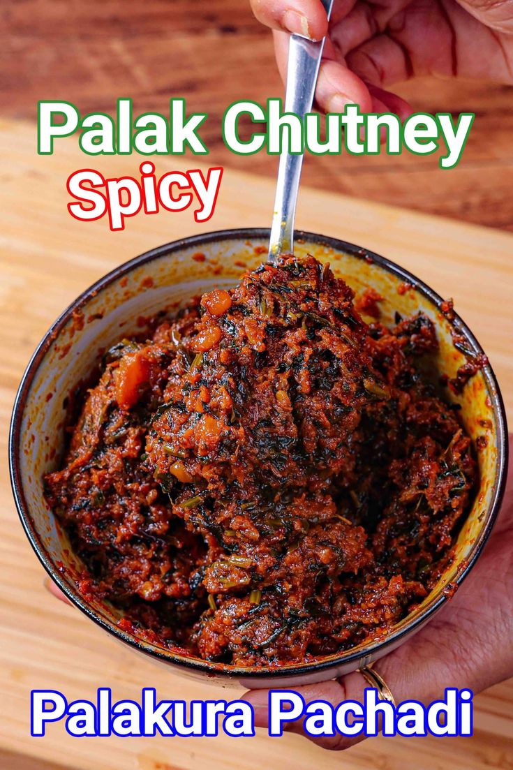 a hand holding a bowl filled with food and the words palak chutney spicy