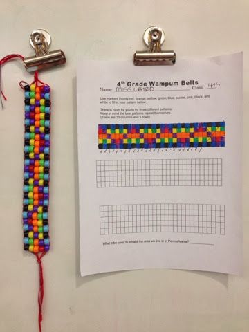 a piece of paper that has some beads on it next to a clipboard with a graph