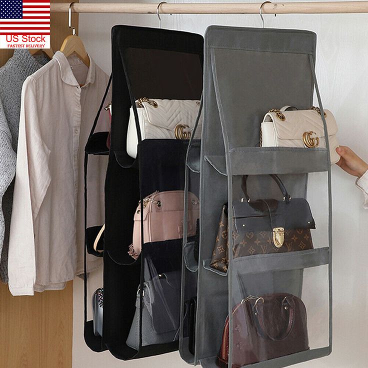 an organized closet with handbags and purses hanging on the wall next to it