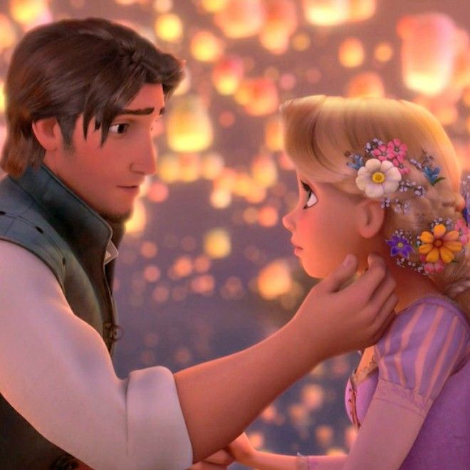 the princess and the frog are touching each other's foreheads in tangled hairs