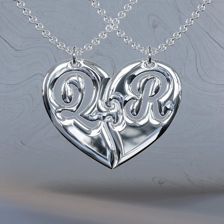 two initials in the shape of a heart on a chain