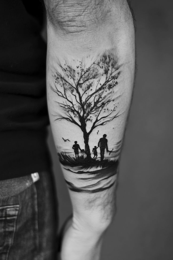 a man with a tree tattoo on his arm