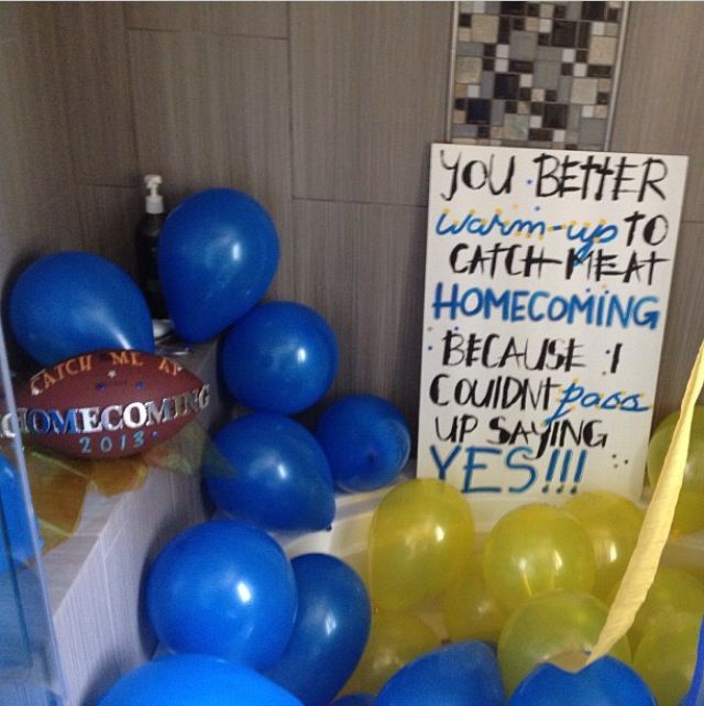 blue and yellow balloons in front of a sign