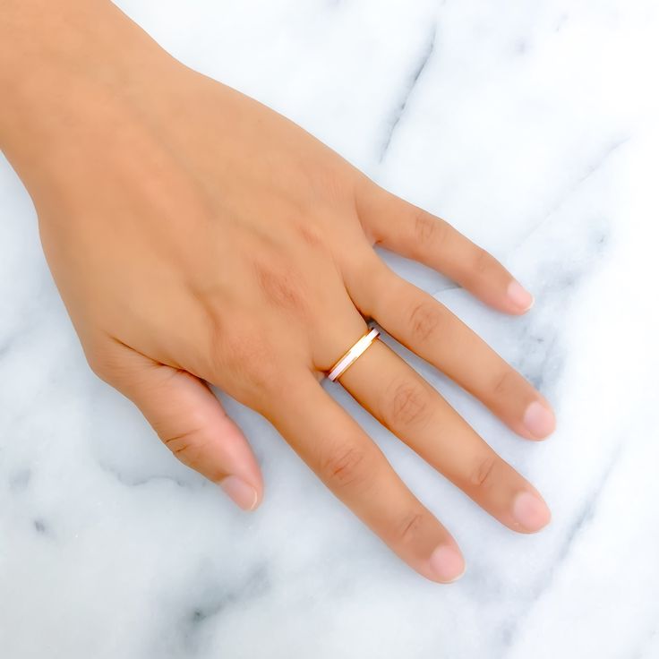 This 22k gold ring captivates with its glossy baby pink enamel finish, beautifully set against a backdrop of yellow gold. It weighs 4.4 grams and is sized at 7, perfectly combining playful charm with a hint of sophistication. Ideal for those who favor a delicate and feminine touch in their jewelry, this band is both eye-catching and elegant. The fixed size ensures the ring's pristine condition and form, making it a timeless choice for anyone looking to add a soft color accent to their collection Gold Ring With Smooth Bezel As Gift, Gold Rings With Smooth Bezel As Gift, Gold Rings With Smooth Bezel For Gift, Classic Gold Open Enamel Ring, Gold Enamel Ring Perfect For Gifting, Gold Enamel Ring Perfect For Gift, Gold Enamel Ring For A Gift, Dainty Gold Enamel Ring Gift, Yellow Gold Stackable Rings Smooth Bezel As Gift