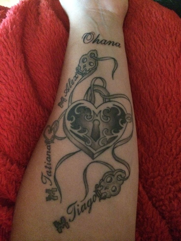 a person with a tattoo on their arm that says, ohana and two hearts